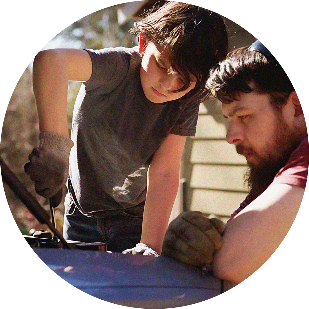 get auto loan protection father and son working on a car